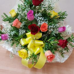 12 mixed coloured roses arranged in a box £ 25