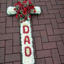Cross 2ft £60. 3ft £75 4ft £85. 5ft £115. Cross with name in flowers 4ft £95. 5ft £125