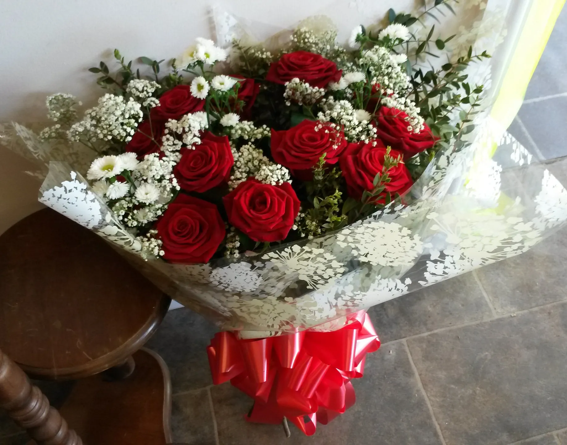 12 beautiful red roses with foliage and gyp £45
